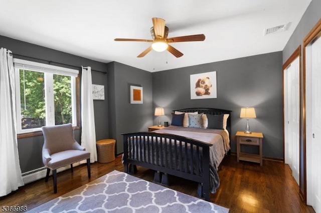 11 Washington St, Mount Olive Twp, NJ 07828 - bedroom with wood finished floors, a baseboard radiator, and a ceiling fan