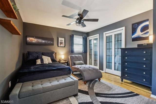 23 Midway Ct, Rockaway Twp, NJ 07866 - bedroom with french doors, light wood finished floors, two closets, and ceiling fan