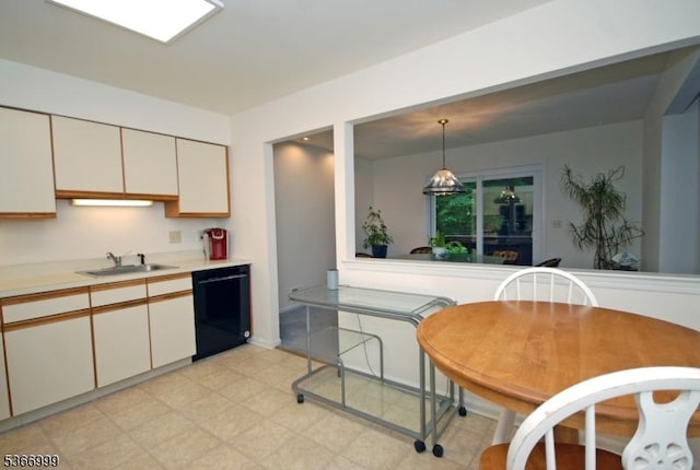 25 Watchung Trl, Branchburg Twp, NJ 08876 - kitchen with black dishwasher, light countertops, white cabinets, light floors, and hanging light fixtures
