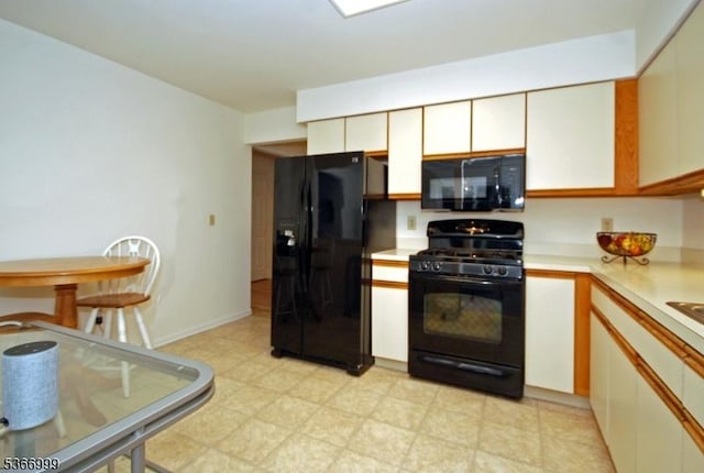 25 Watchung Trl, Branchburg Twp, NJ 08876 - kitchen featuring black appliances, light countertops, light floors, and white cabinets