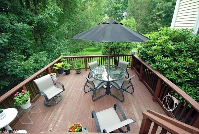 25 Watchung Trl, Branchburg Twp, NJ 08876 - wooden deck with outdoor dining space and a forest view