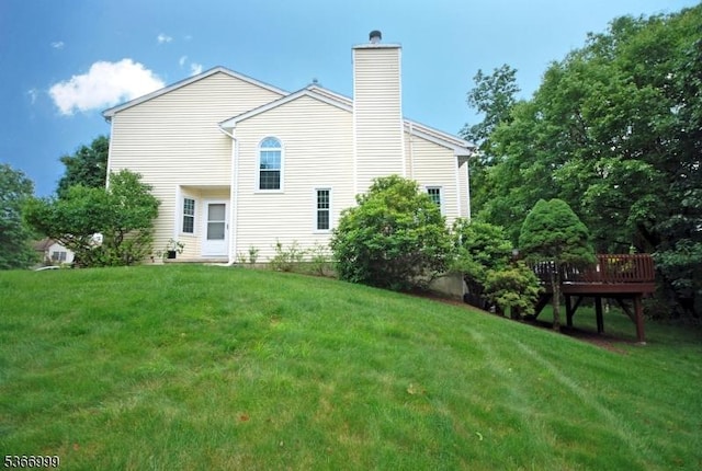 25 Watchung Trl, Branchburg Twp, NJ 08876 - rear view of house with a chimney, a yard, and a wooden deck