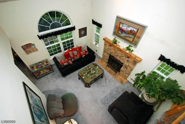 25 Watchung Trl, Branchburg Twp, NJ 08876 - carpeted living room with a stone fireplace and a high ceiling