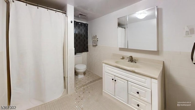 979 Lorraine Ave, Union Twp, NJ 07083 - bathroom featuring vanity, tile walls, tile patterned flooring, a wainscoted wall, and a shower with shower curtain