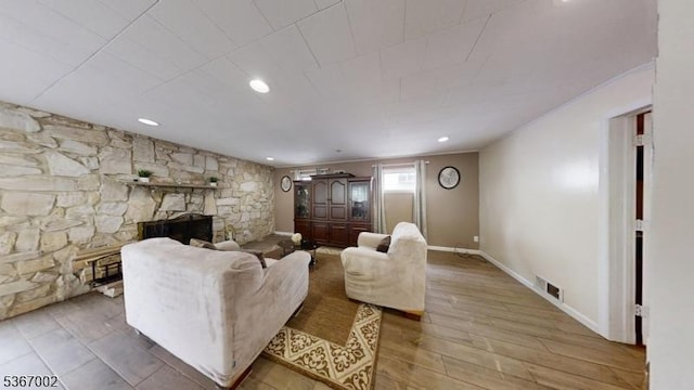 979 Lorraine Ave, Union Twp, NJ 07083 - living room with a stone fireplace, light wood finished floors, and recessed lighting