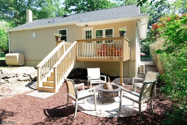 4 Bear Pond Trl, Hopatcong Boro, NJ 07821 - rear view of house with a fire pit, stairway, a deck, and roof with shingles