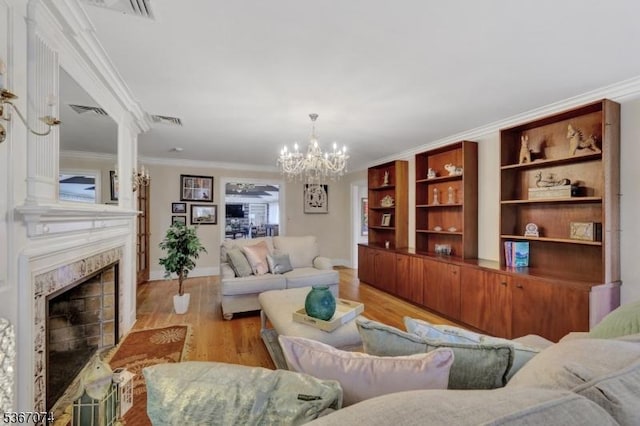 11 Clyde Ct, Bergenfield Boro, NJ 07621 - living area with a chandelier, a fireplace, crown molding, and light wood-style floors
