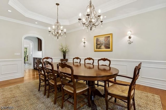 1 Bates Way, Westfield Town, NJ 07090 - dining room with arched walkways, wood finished floors, a chandelier, a wainscoted wall, and a tray ceiling