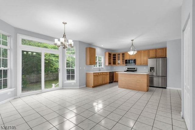 3 Whisper Way, Barnegat Twp, NJ 08005 - kitchen featuring appliances with stainless steel finishes, light tile patterned floors, light countertops, a chandelier, and pendant lighting