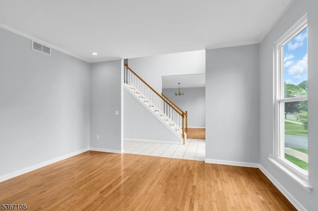 3 Whisper Way, Barnegat Twp, NJ 08005 - unfurnished living room featuring stairs, a chandelier, wood finished floors, and ornamental molding