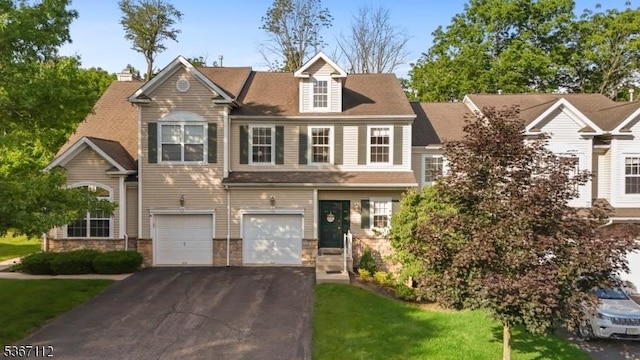 73 Pinehurst Dr, Washington Twp, NJ 07882 - townhome / multi-family property featuring driveway, a garage, and a front yard