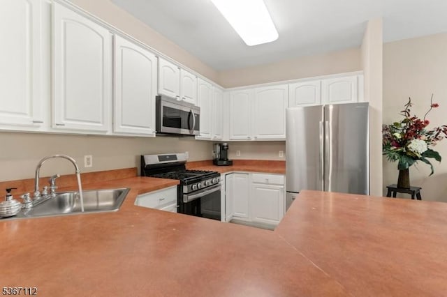 73 Pinehurst Dr, Washington Twp, NJ 07882 - kitchen featuring stainless steel appliances, white cabinets, and light countertops