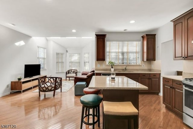 51 Carlisle Rd, Bernards Twp, NJ 07920 - kitchen with open floor plan, healthy amount of natural light, light wood finished floors, recessed lighting, and lofted ceiling