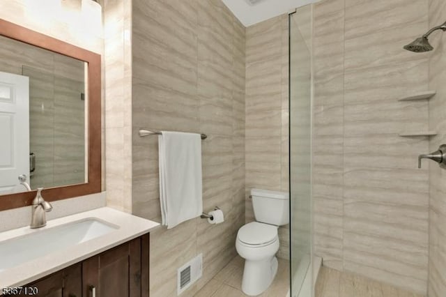 51 Carlisle Rd, Bernards Twp, NJ 07920 - bathroom featuring vanity, a stall shower, tile walls, and tile patterned flooring
