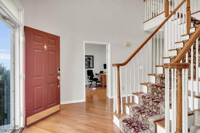 51 Carlisle Rd, Bernards Twp, NJ 07920 - entryway with light wood-style floors, a towering ceiling, and stairway