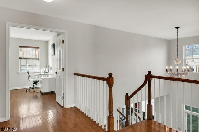 51 Carlisle Rd, Bernards Twp, NJ 07920 - hallway featuring an upstairs landing, a chandelier, and wood-type flooring