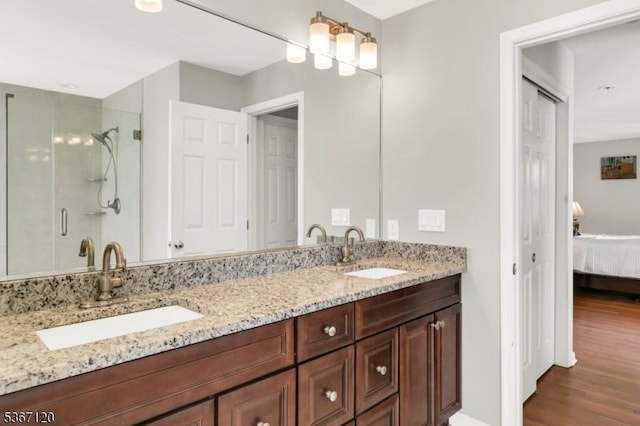 51 Carlisle Rd, Bernards Twp, NJ 07920 - bathroom with connected bathroom, double vanity, wood finished floors, and a shower stall