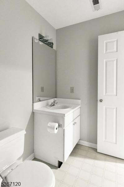 51 Carlisle Rd, Bernards Twp, NJ 07920 - half bath with vanity and tile patterned floors