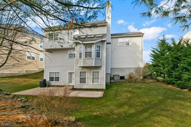 51 Carlisle Rd, Bernards Twp, NJ 07920 - back of house with a patio, a yard, and a chimney