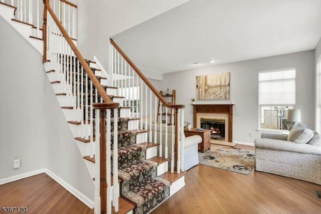 51 Carlisle Rd, Bernards Twp, NJ 07920 - stairs featuring wood finished floors and a glass covered fireplace