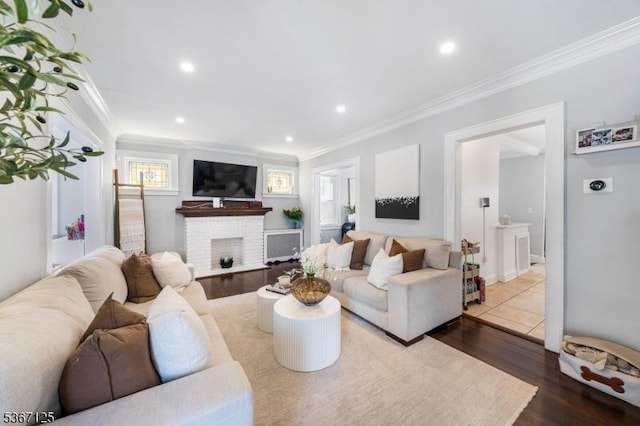 1697 Van Ness Ter, Union Twp, NJ 07083 - living room featuring ornamental molding, wood finished floors, a brick fireplace, and recessed lighting