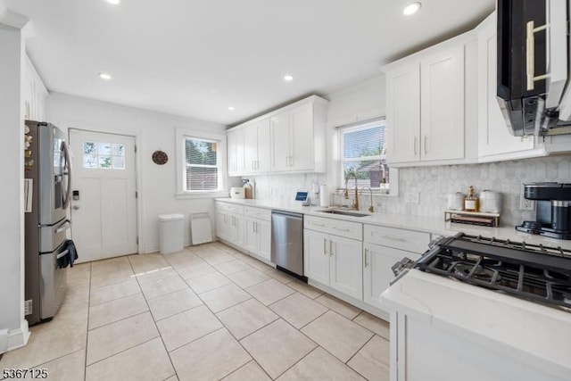 1697 Van Ness Ter, Union Twp, NJ 07083 - kitchen with appliances with stainless steel finishes, backsplash, white cabinets, recessed lighting, and light tile patterned floors