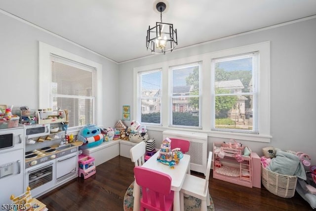 1697 Van Ness Ter, Union Twp, NJ 07083 - game room featuring a chandelier, plenty of natural light, ornamental molding, and dark wood-style flooring