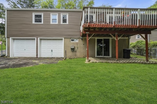32 Mountain Heights Dr, Byram Twp, NJ 07871 - rear view of house featuring an attached garage, a wooden deck, and driveway