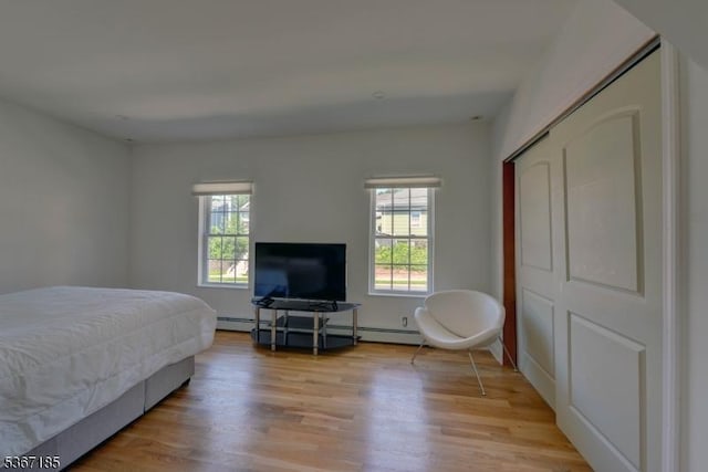 55 Florence St, Nutley Twp, NJ 07110 - bedroom with multiple windows and light wood-style flooring