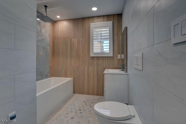 55 Florence St, Nutley Twp, NJ 07110 - bathroom featuring tile walls, vanity, a combined bath / shower with rainfall shower, and recessed lighting