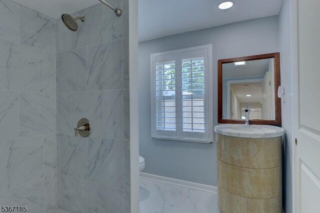 55 Florence St, Nutley Twp, NJ 07110 - bathroom featuring tiled shower, marble finish floors, and vanity