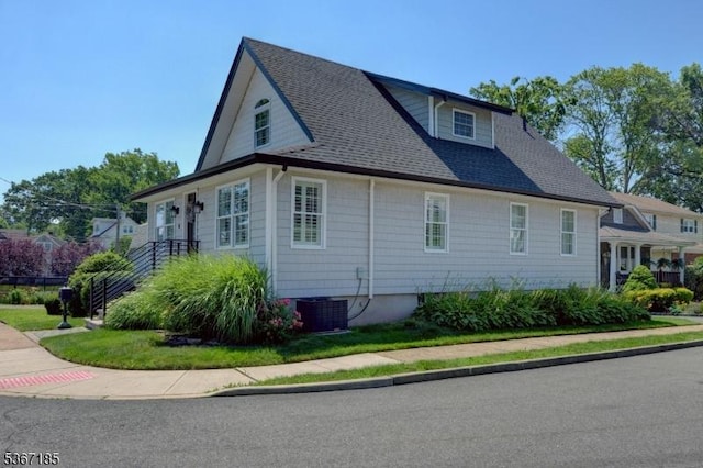 55 Florence St, Nutley Twp, NJ 07110 - view of home's exterior with a central air condition unit and a shingled roof