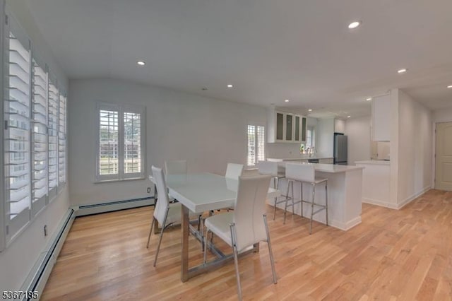 55 Florence St, Nutley Twp, NJ 07110 - dining room featuring a baseboard heating unit, plenty of natural light, light wood-type flooring, and recessed lighting