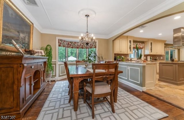 1117 Califon Cokesbury Rd, Lebanon Twp, NJ 08833 - dining area featuring a chandelier, light wood-style flooring, crown molding, a wainscoted wall, and recessed lighting