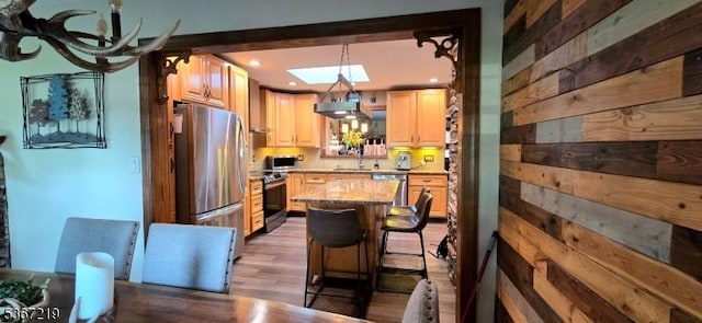 301 Ohio Ave, Pohatcong Twp, NJ 08865 - kitchen featuring stainless steel appliances, a skylight, recessed lighting, wood finished floors, and a kitchen island
