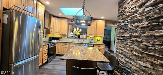 301 Ohio Ave, Pohatcong Twp, NJ 08865 - kitchen with appliances with stainless steel finishes, wall chimney range hood, a skylight, a center island, and dark wood finished floors