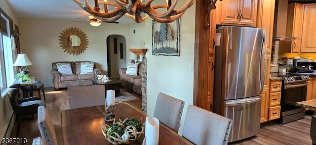 301 Ohio Ave, Pohatcong Twp, NJ 08865 - dining space with arched walkways, wood finished floors, and ceiling fan