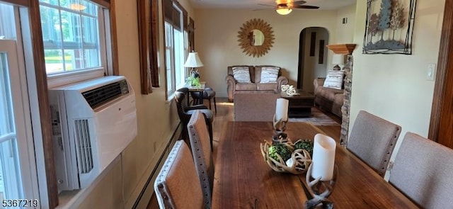 301 Ohio Ave, Pohatcong Twp, NJ 08865 - dining room featuring arched walkways, a ceiling fan, and wood finished floors