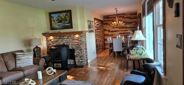 301 Ohio Ave, Pohatcong Twp, NJ 08865 - living room with a chandelier, wood finished floors, and a wood stove