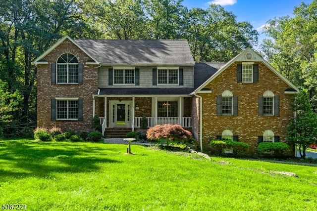 15 Colby Farm Rd, Chester Twp, NJ 07930 - traditional-style house featuring a porch, brick siding, and a front yard