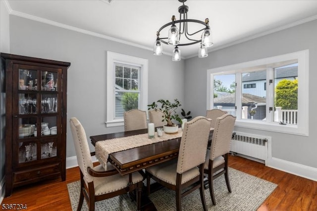 188 Wheaton Pl, Rutherford Boro, NJ 07070 - dining space with radiator, ornamental molding, plenty of natural light, a chandelier, and wood finished floors
