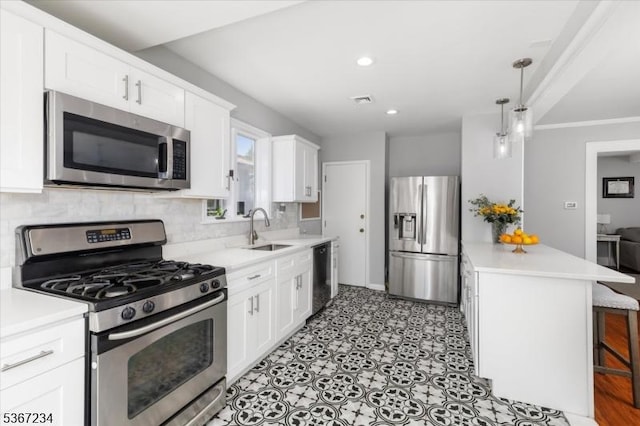 188 Wheaton Pl, Rutherford Boro, NJ 07070 - kitchen featuring appliances with stainless steel finishes, light countertops, tasteful backsplash, white cabinetry, and a peninsula