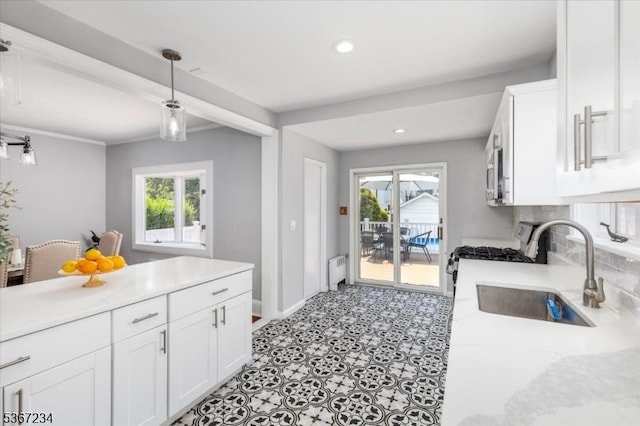 188 Wheaton Pl, Rutherford Boro, NJ 07070 - kitchen with white gas range, white cabinets, healthy amount of natural light, tasteful backsplash, and recessed lighting