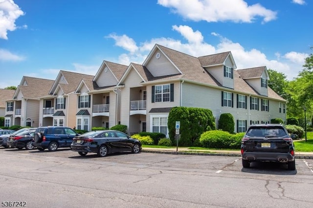 372 Cambridge Dr Unit 372, Butler Boro, NJ 07405 - townhome / multi-family property with uncovered parking, roof with shingles, and a residential view