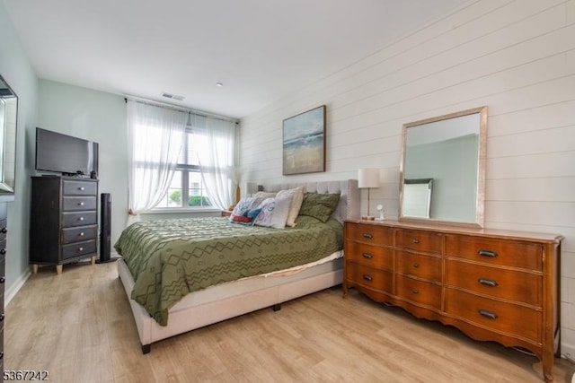 372 Cambridge Dr Unit 372, Butler Boro, NJ 07405 - bedroom featuring light wood-type flooring and wooden walls