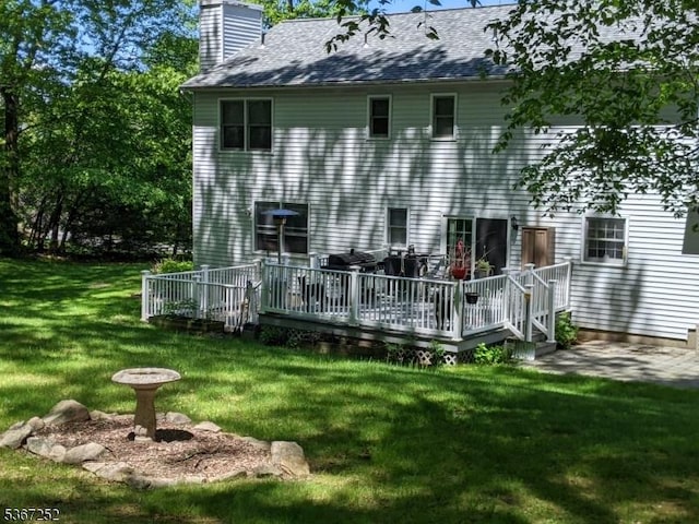 20 Highland Rd, Independence Twp, NJ 07840 - back of house with a chimney, a wooden deck, and a yard