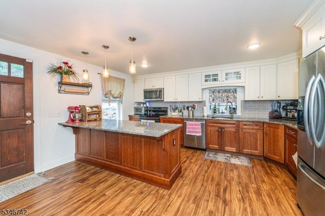 28 Middle Valley Rd, Washington Twp, NJ 07853 - kitchen featuring appliances with stainless steel finishes, a peninsula, dark wood-style floors, and white cabinets