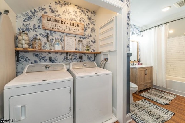 28 Middle Valley Rd, Washington Twp, NJ 07853 - laundry area with wood finished floors, independent washer and dryer, and wallpapered walls