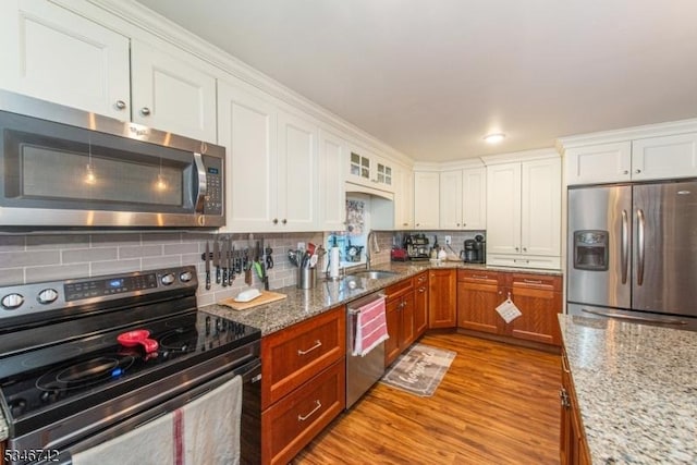 28 Middle Valley Rd, Washington Twp, NJ 07853 - kitchen featuring appliances with stainless steel finishes, tasteful backsplash, light wood-type flooring, and white cabinets