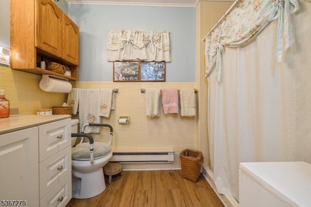 2 Hazelnut Dr, Hampton Twp, NJ 07860 - bathroom featuring a baseboard heating unit, tile walls, curtained shower, wood finished floors, and vanity